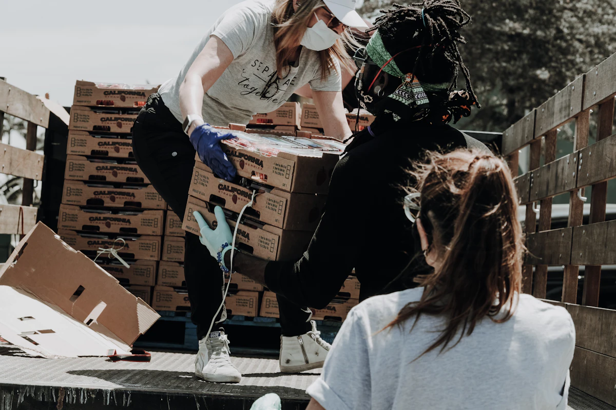 Volunteers distributing clothing and supplies to people in need